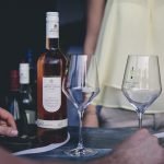 A photo of Apatsagi wine and two wine glasses
