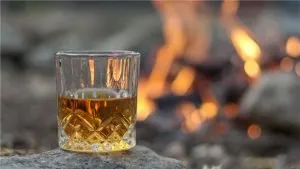 A photo of a glass of whiskey